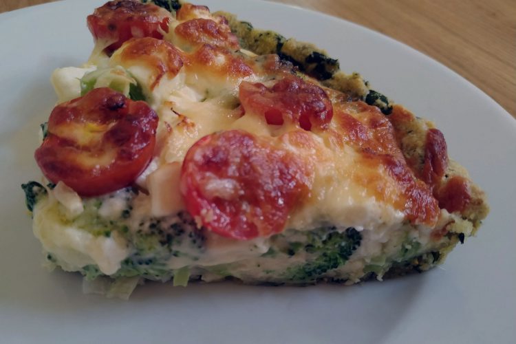 broccoli-pie-quarter-on-white-plate-on-table