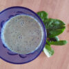 Green smoothie in a blue glass