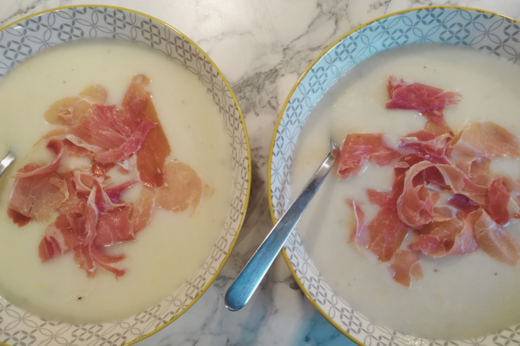 Two bowls of melon soup on counter